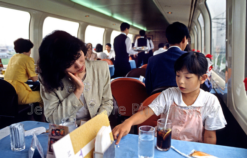 J-0628-1990 edited-0001 
 Mother and child on a Shinkansen bullet train, Japan