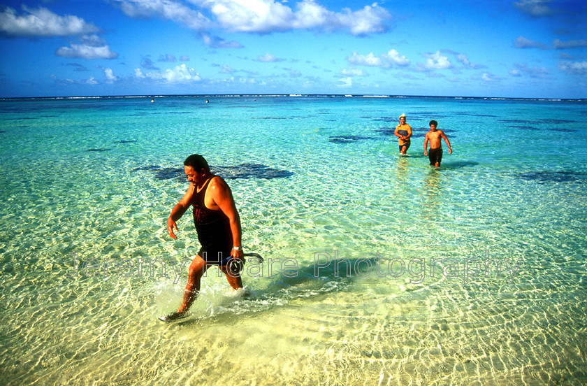 Cook-Islands-0006 
 Man walking out of Aroa Lagoon, Rarotonga, Cook Islands