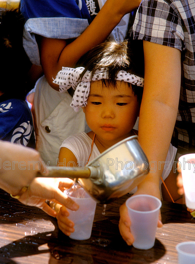 People-J4930-Thirsty-boy 
 Thirsty boy at a summer fair, Uwajima, Japan