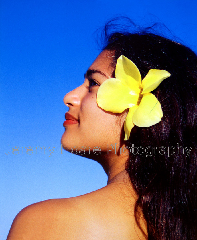 Cook-Islands-0009 
 Girl with frangipani, Rarotonga, Cook Islands 
 Keywords: Rarotonga, Cook Islands