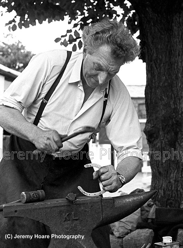 E-5820 edited-0001-FB 
 Photo taken in 1974 of farrier Bob Marshall at work in Donald McCains yard Southport where he shod the great Red Rum, winner of three Grand Nationals.