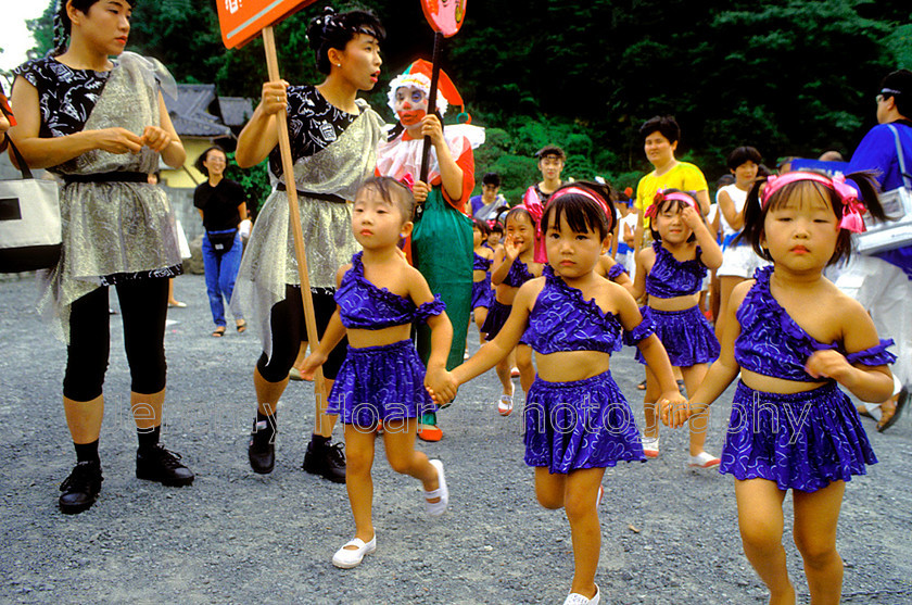 Travel-J4424-Girls-running 
 Three girls running at a summer fair, Uwajima, Japan